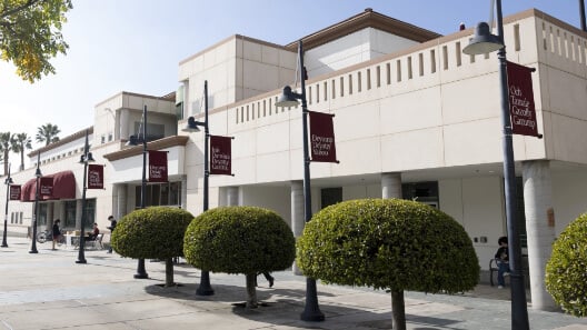 a building with a few bushes