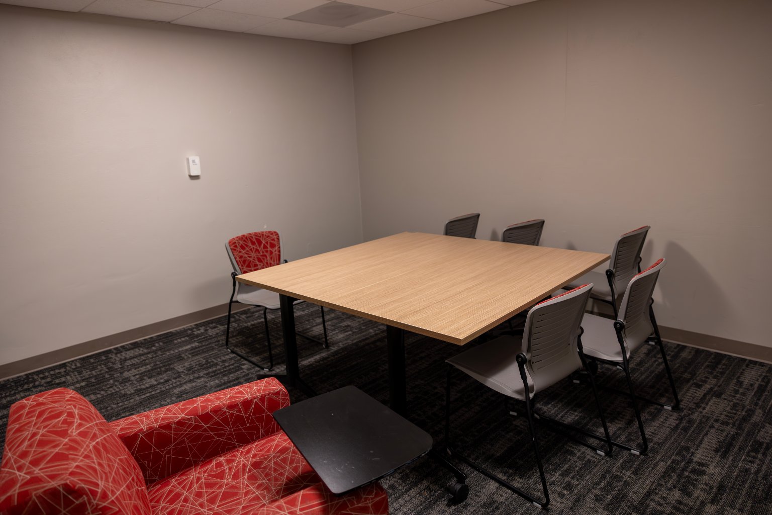 a room with a table and chairs