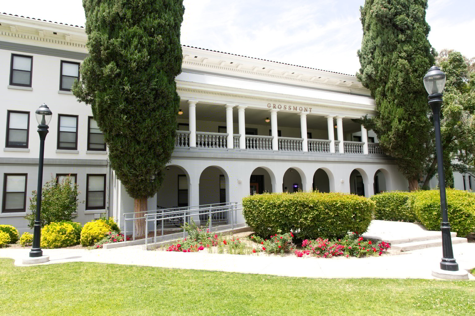 a building with a lawn and trees