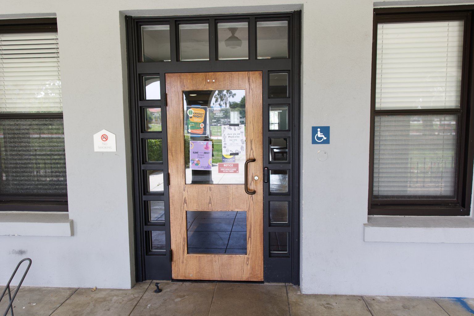 a door with glass panels and a sign