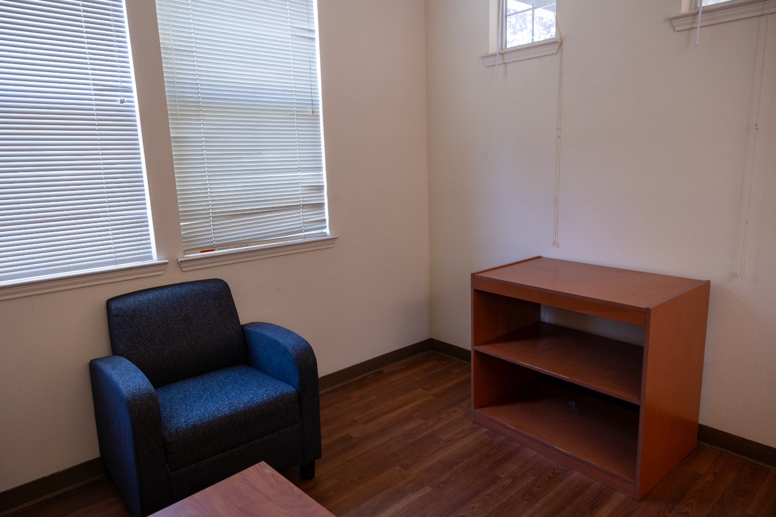 a room with a chair and a table