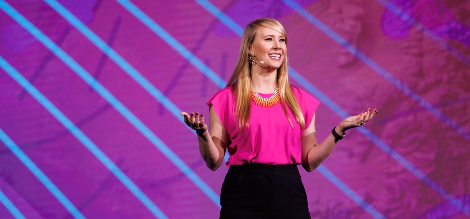 a woman in pink shirt and black pants