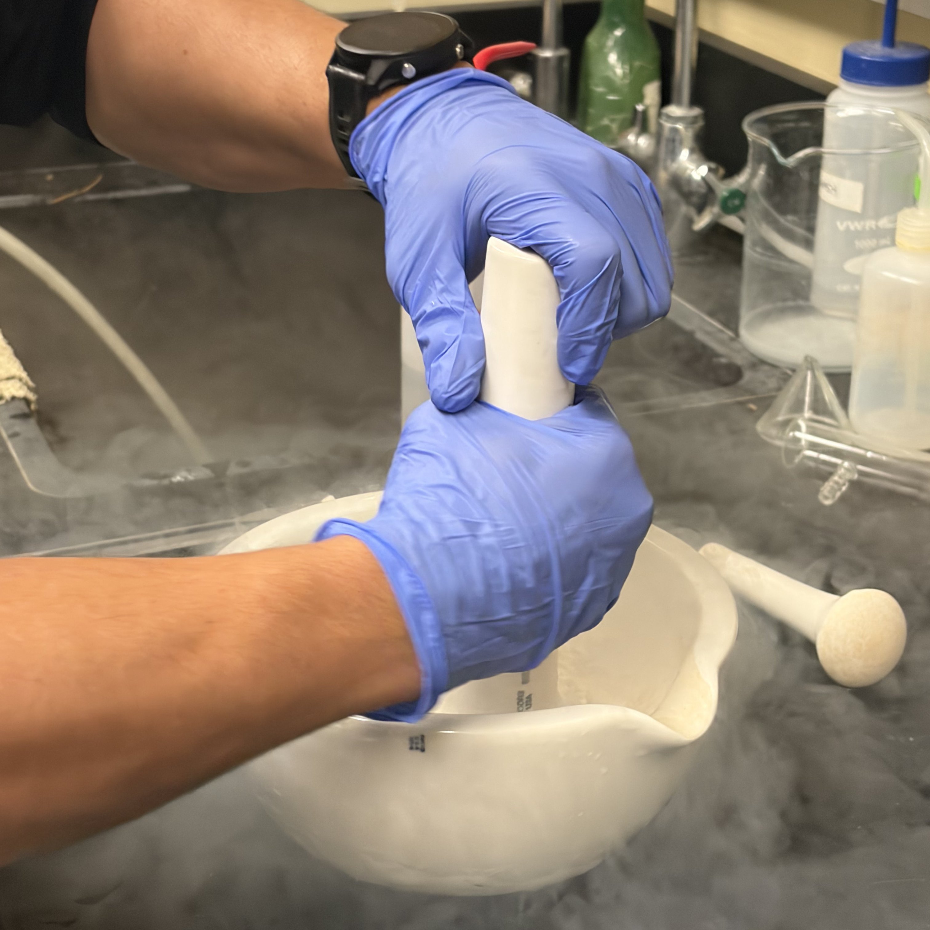 a person holding a white object with smoke in it