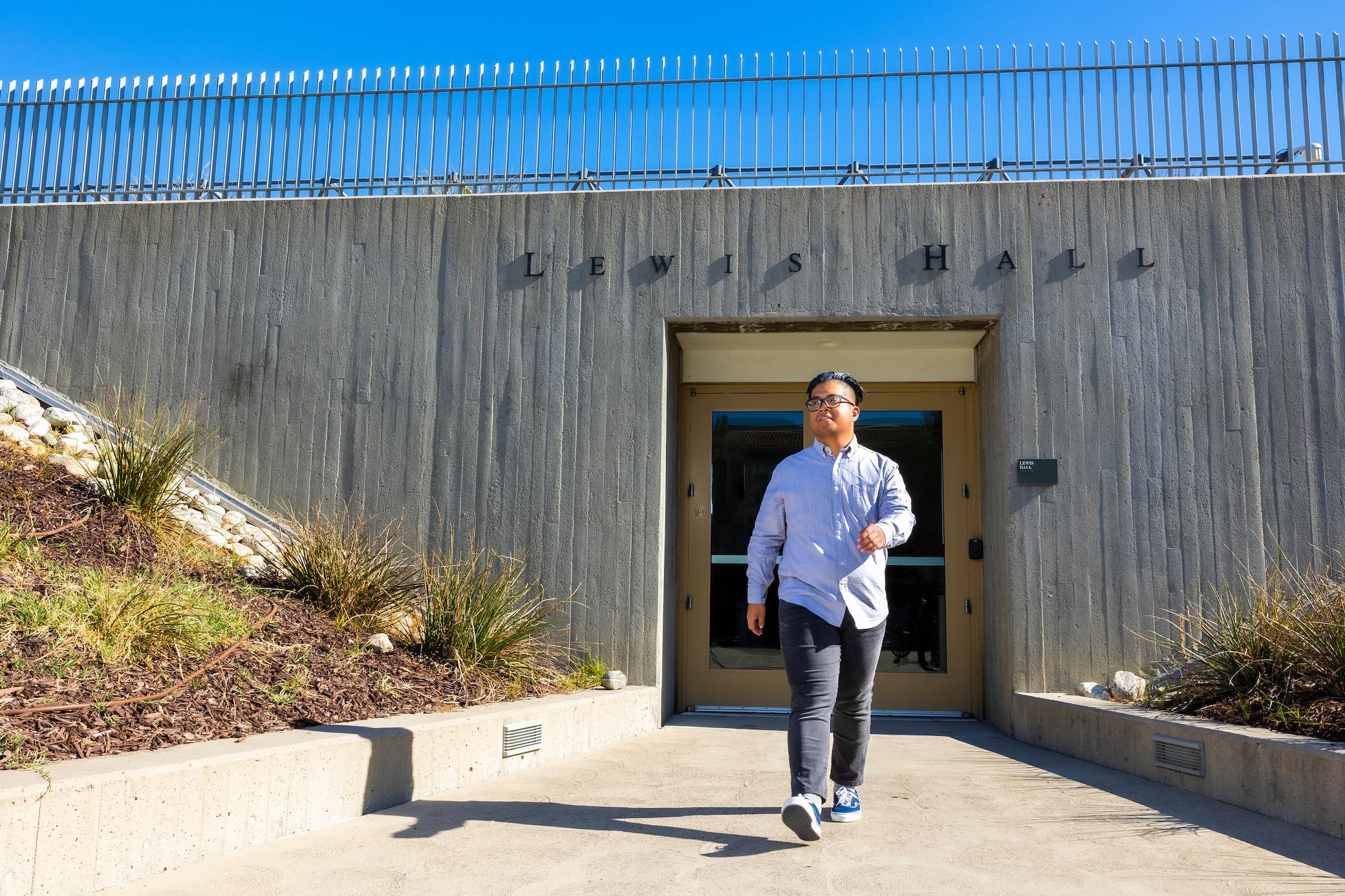 a man walking in front of a building