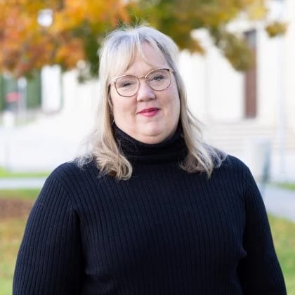 a woman in a black sweater