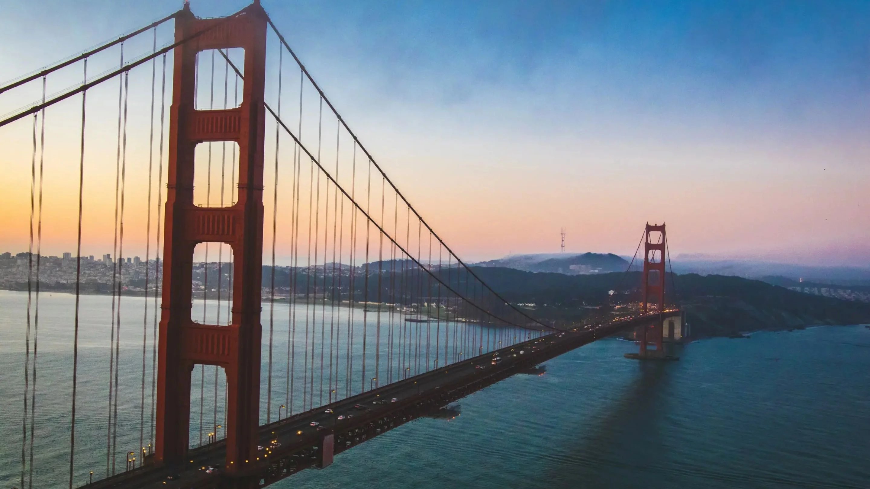 Golden Gate Bridge over water with cars on it