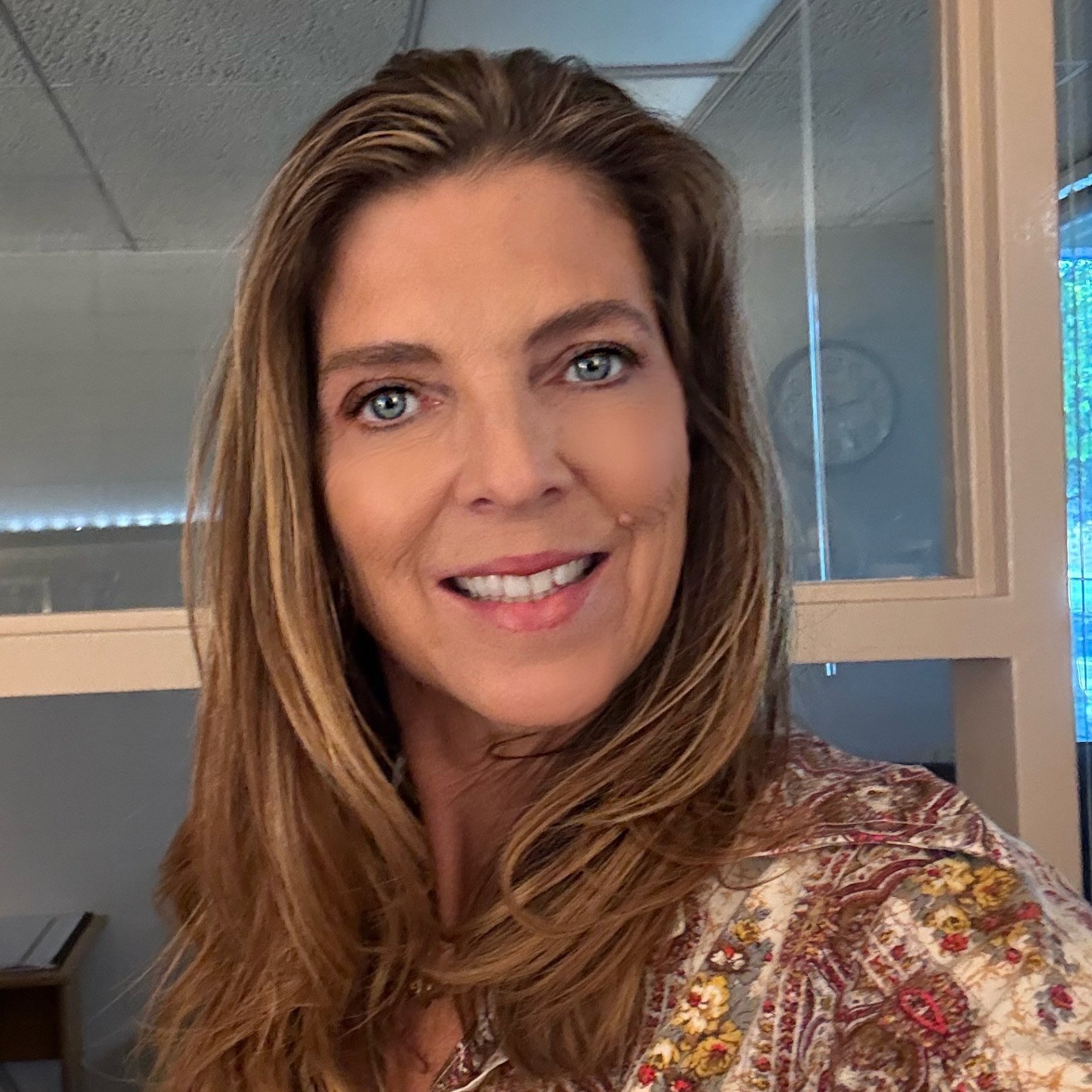 a person smiling at the camera