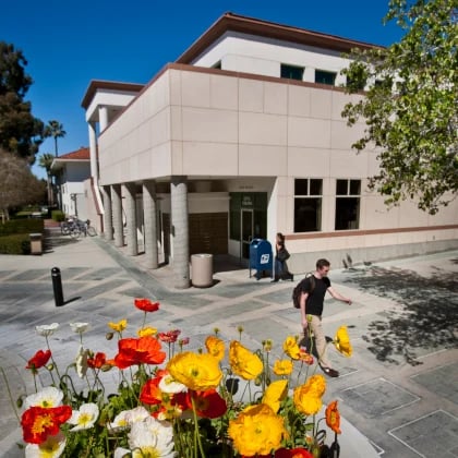 a person walking in front of a building