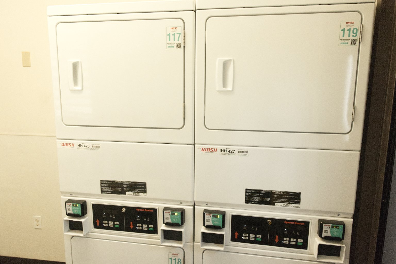 a group of white laundry machines