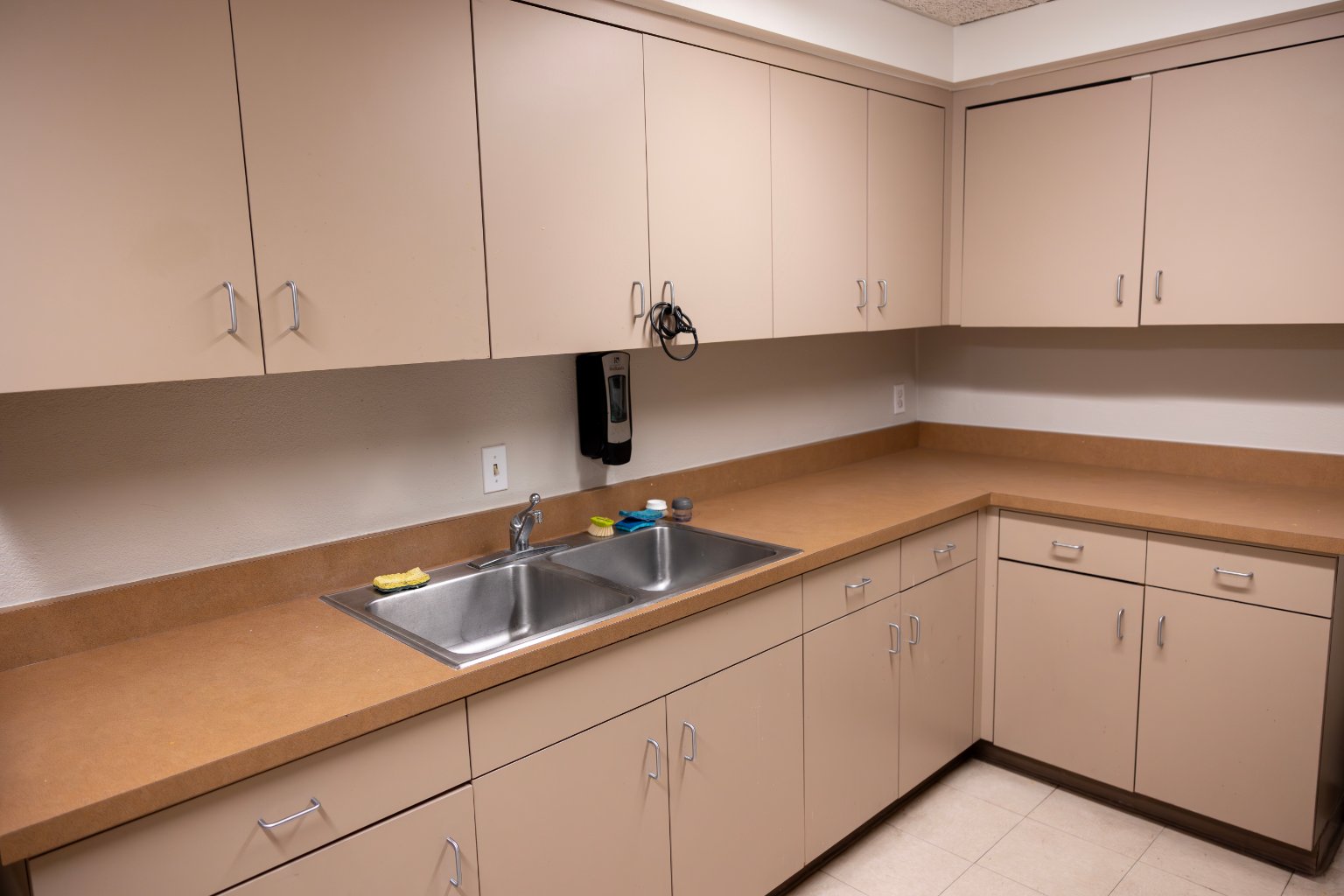 a kitchen with a sink and cabinets
