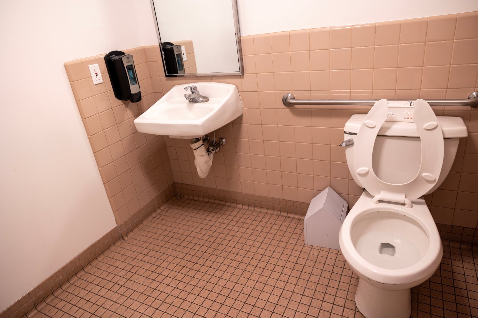 a bathroom with a sink and toilet