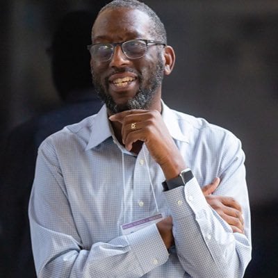 a person with his hand on his chin