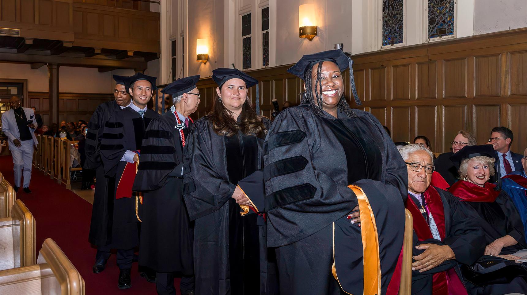 a group of people in graduation gowns