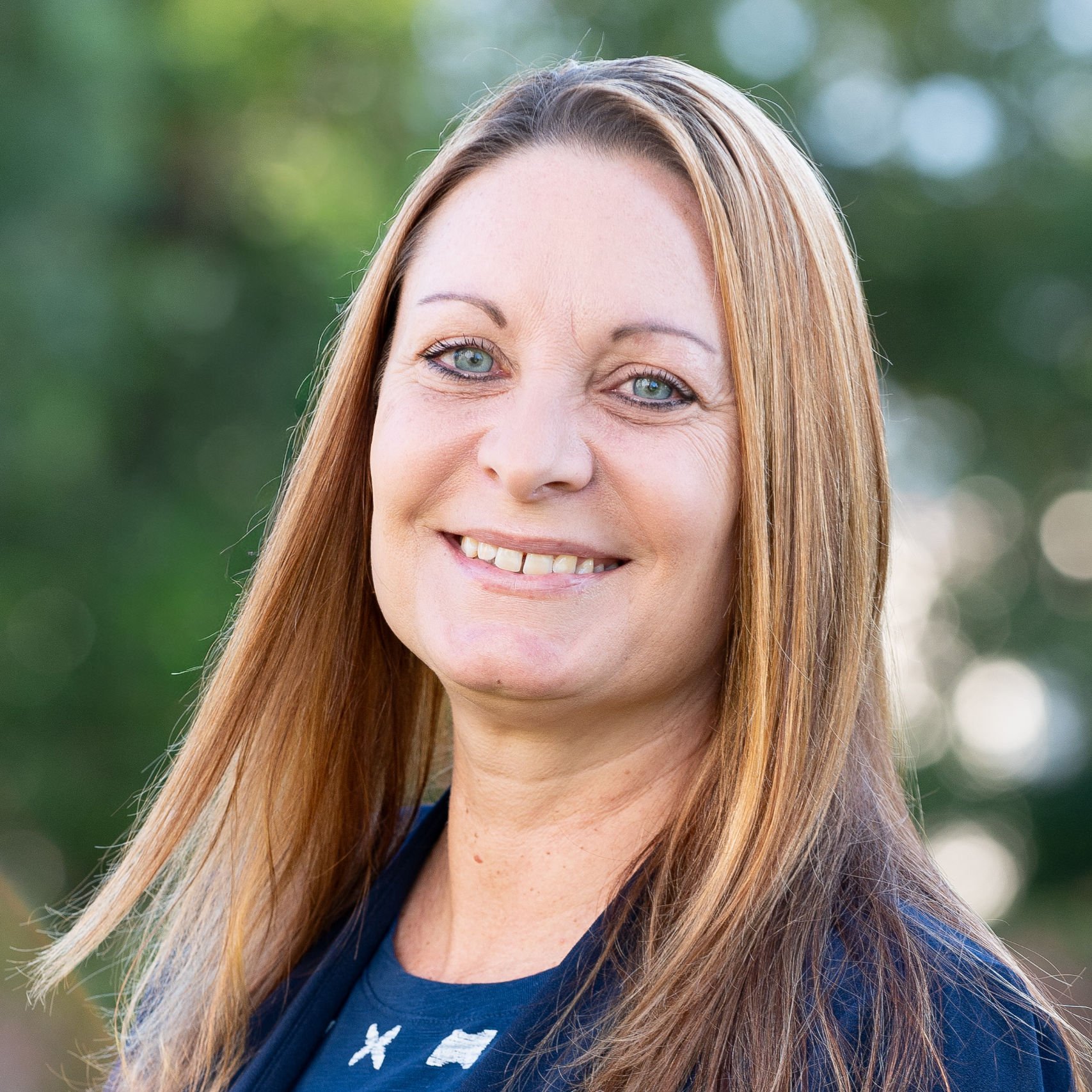 a woman smiling for a picture