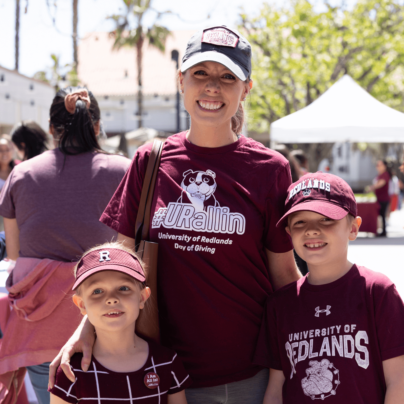 a woman and two children posing for a picture