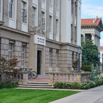 a building with a lawn and a bike rack