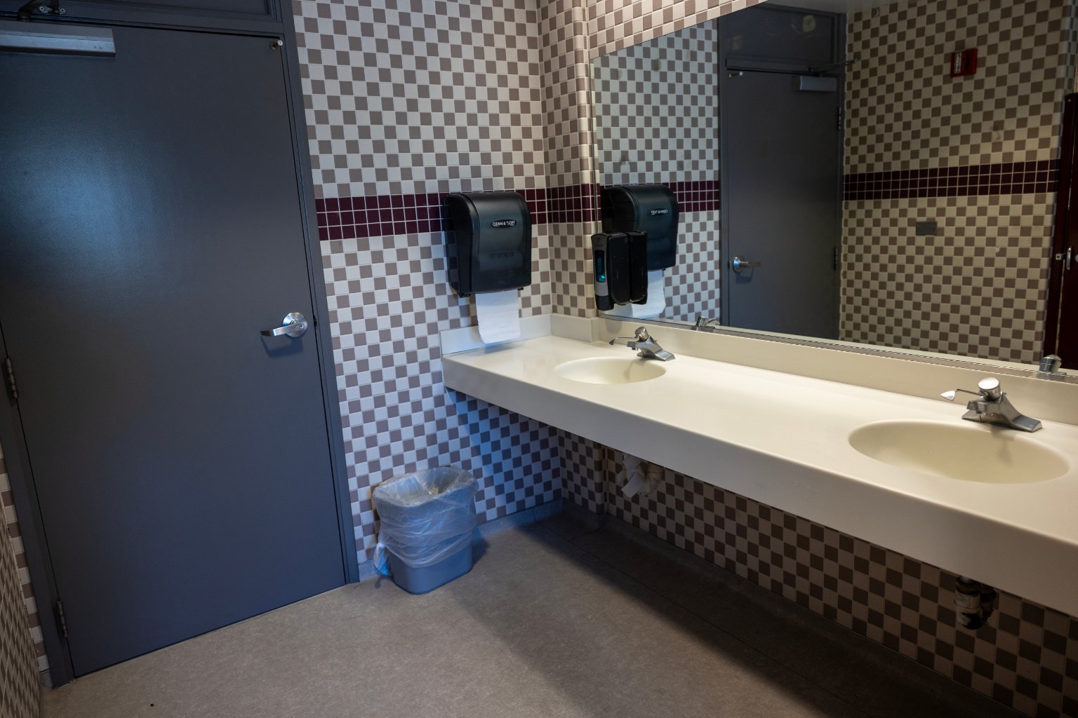 a bathroom with a mirror and a sink