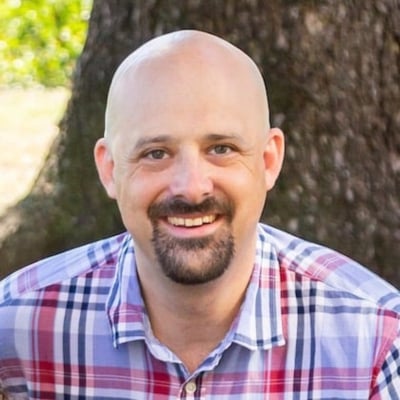 a person smiling for the camera