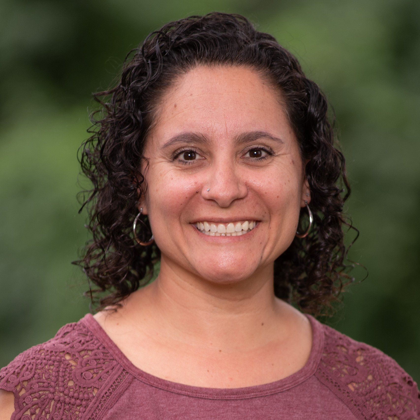 a woman smiling for a picture