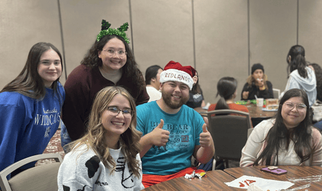 a group of people sitting at a table