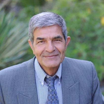 a person in a suit smiling