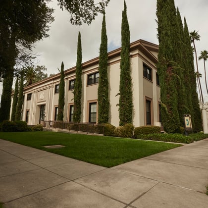 a building with trees on the side