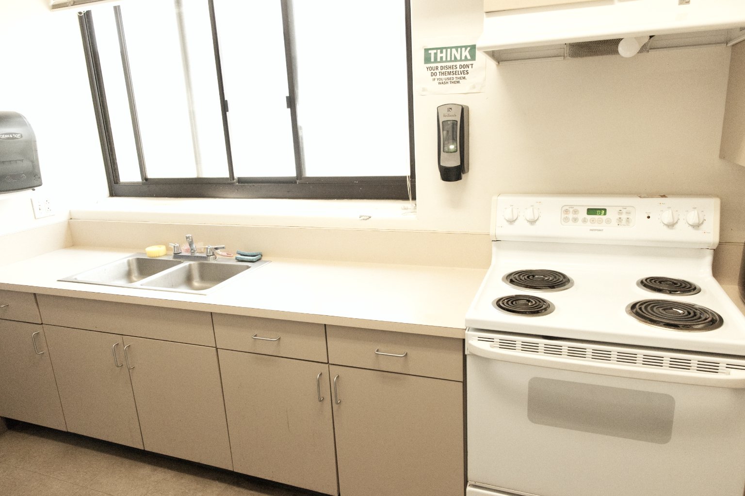 a kitchen with a sink and stove