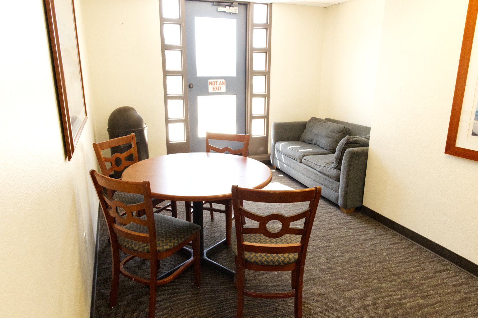 a room with a table and chairs