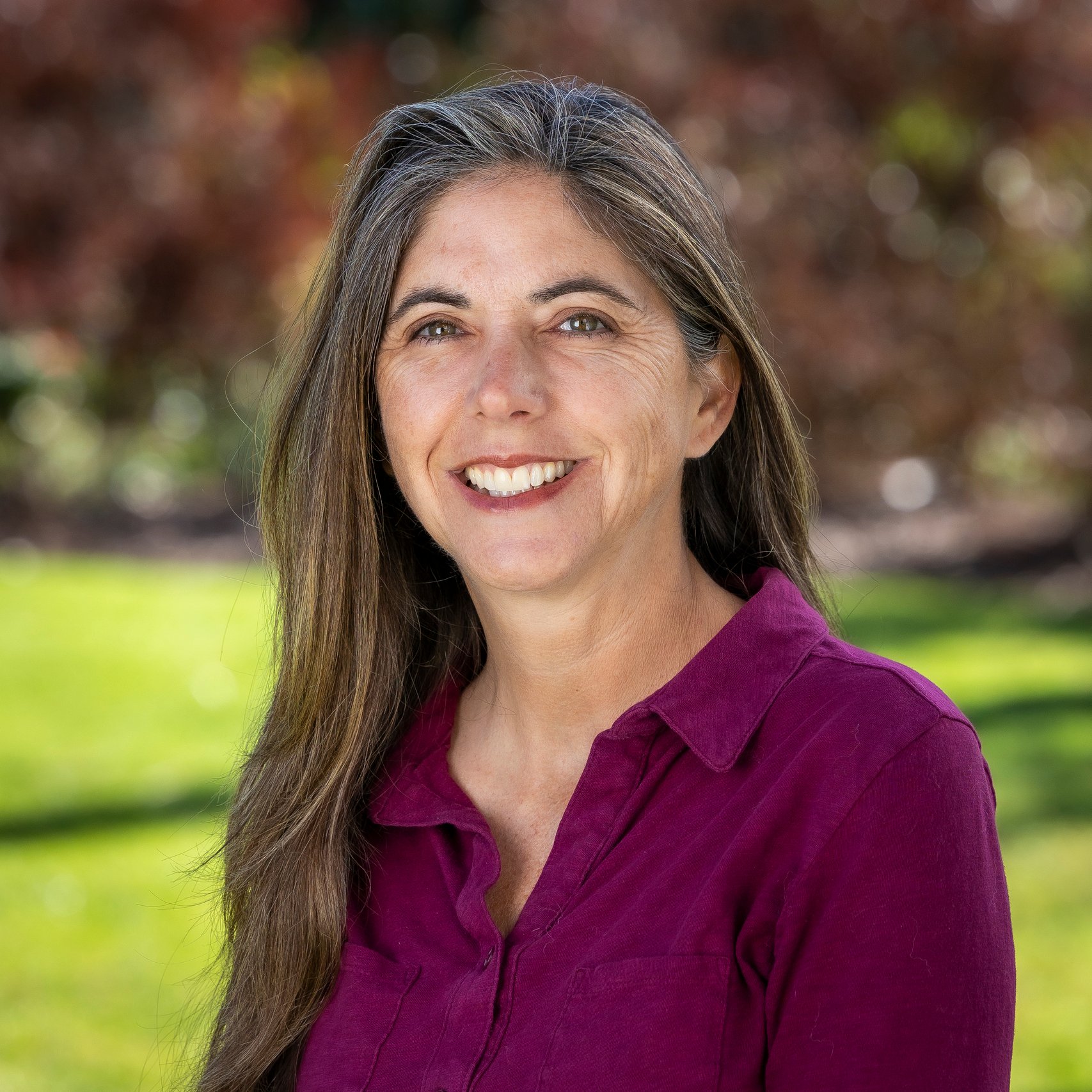 a woman smiling at camera
