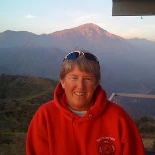a woman in a red sweatshirt