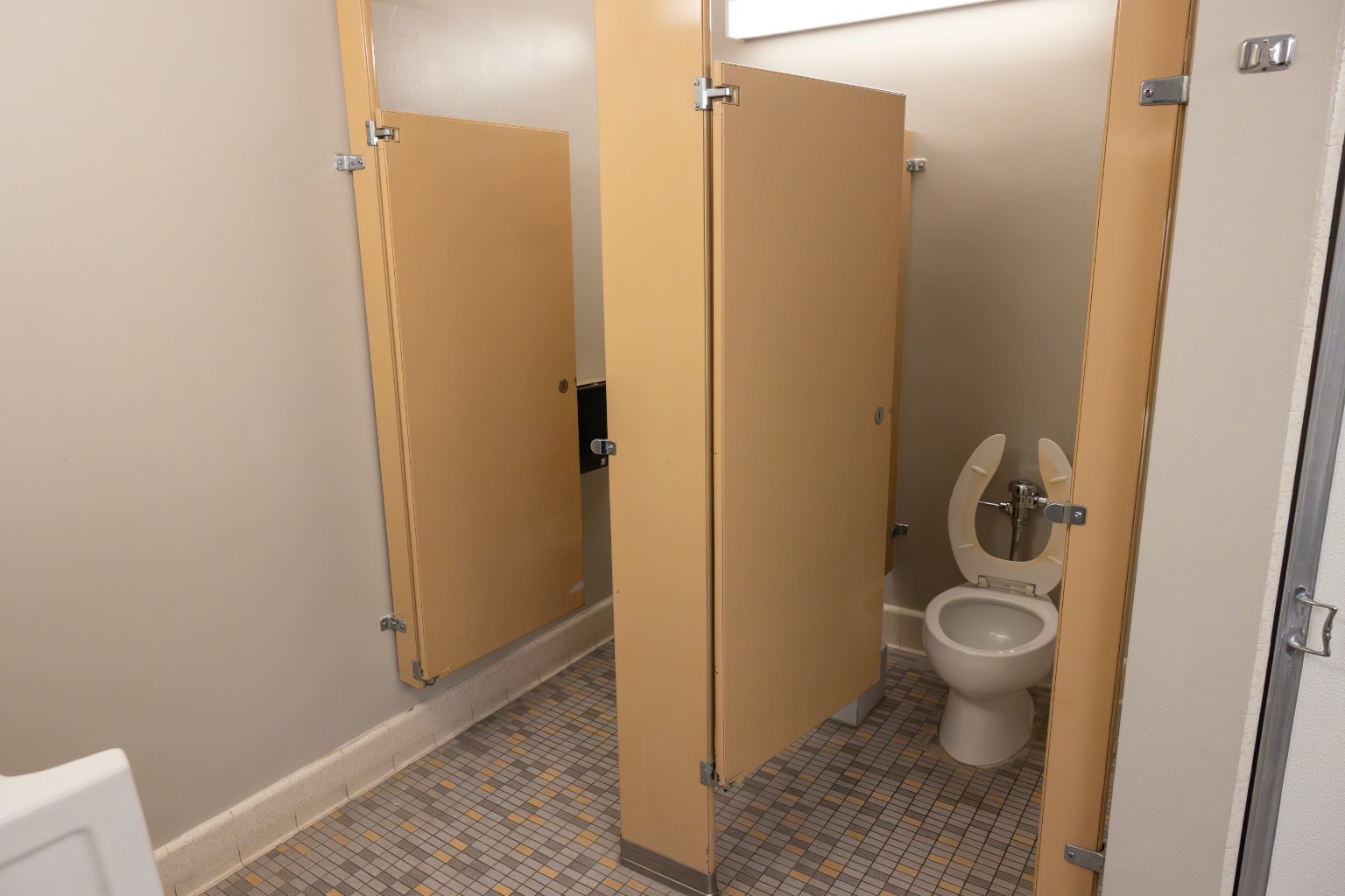 a bathroom stall with doors