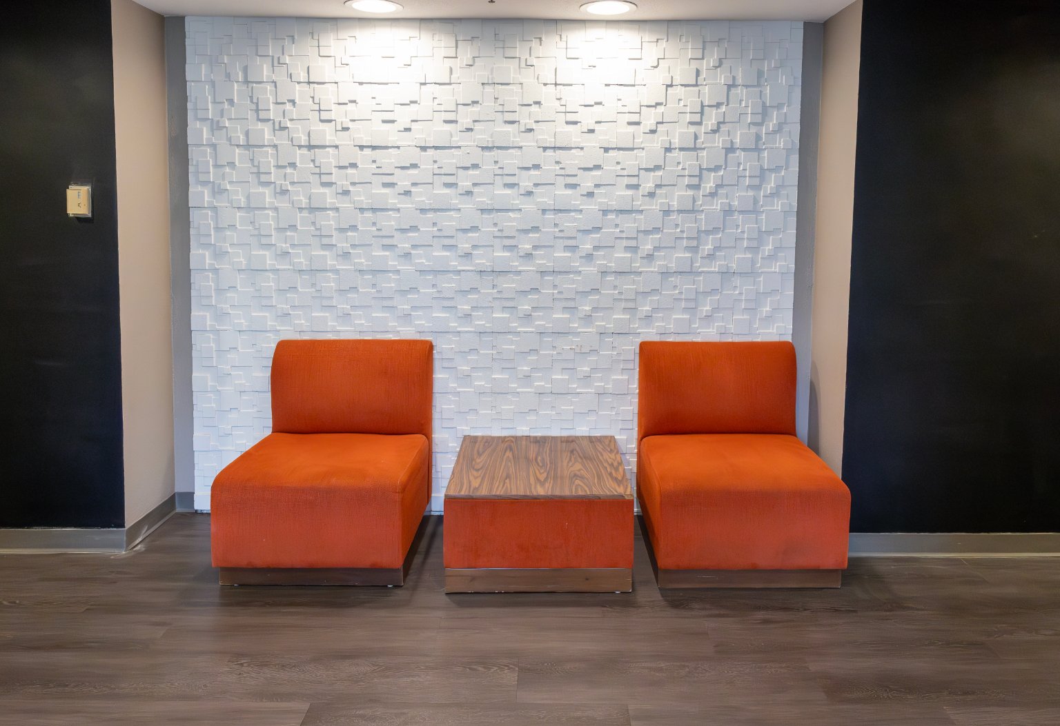 two chairs and a table in a room