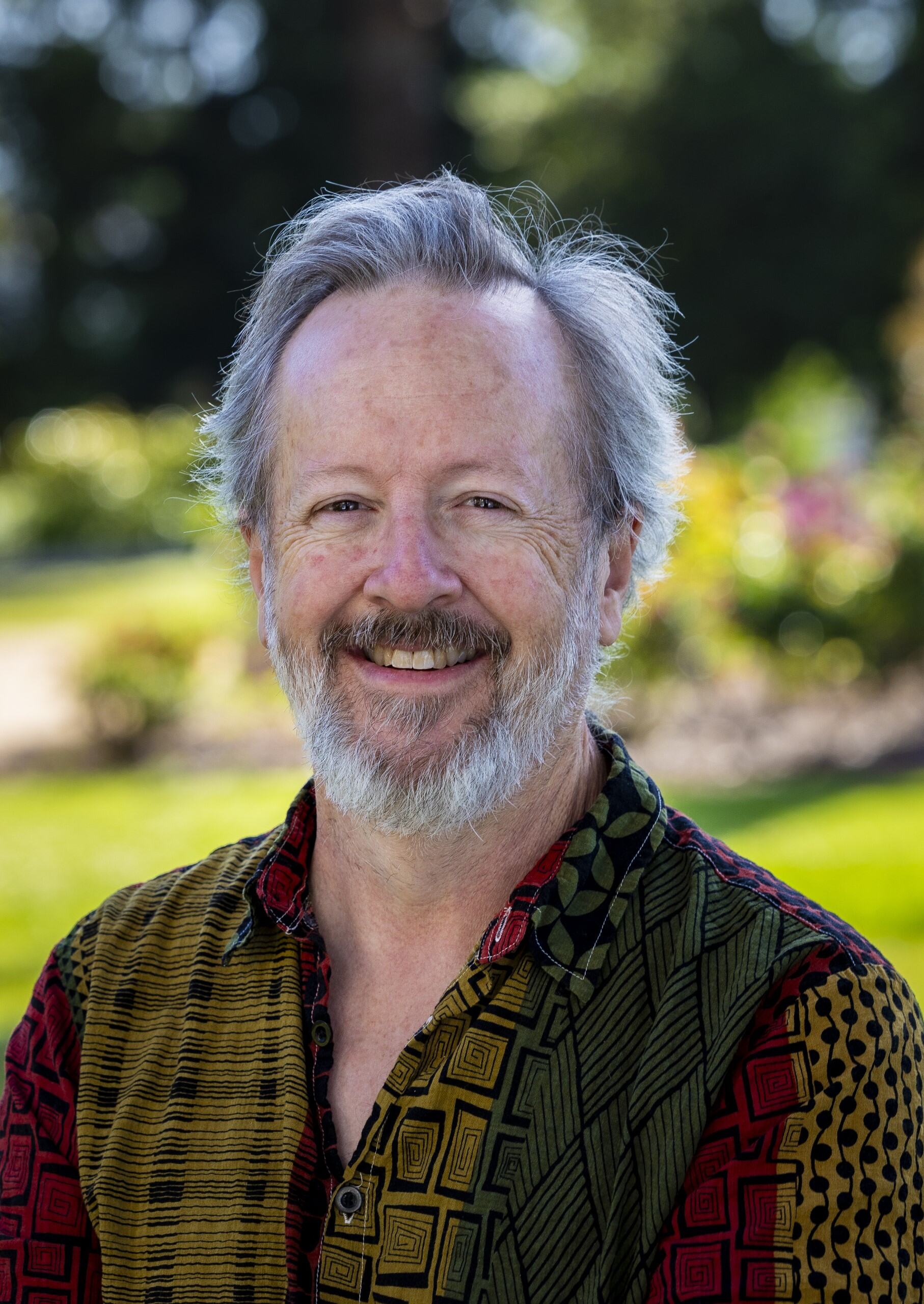 a person with a beard smiling