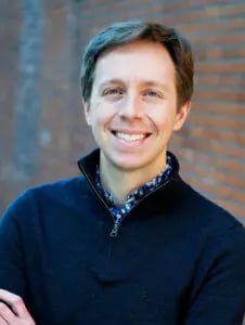 a man smiling at the camera