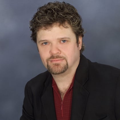 a person with a goatee and a beard