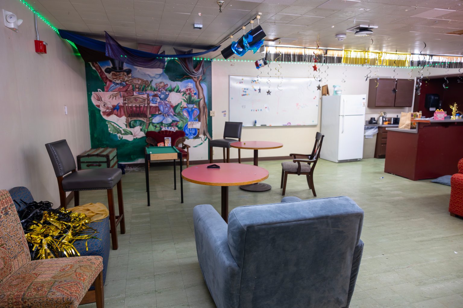 a room with chairs and tables