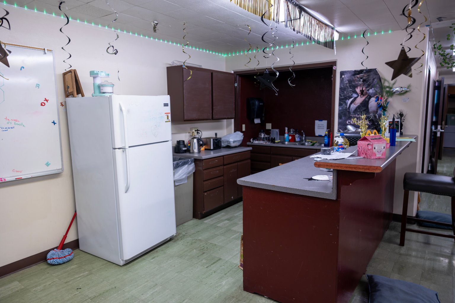 a kitchen with a counter top and a refrigerator