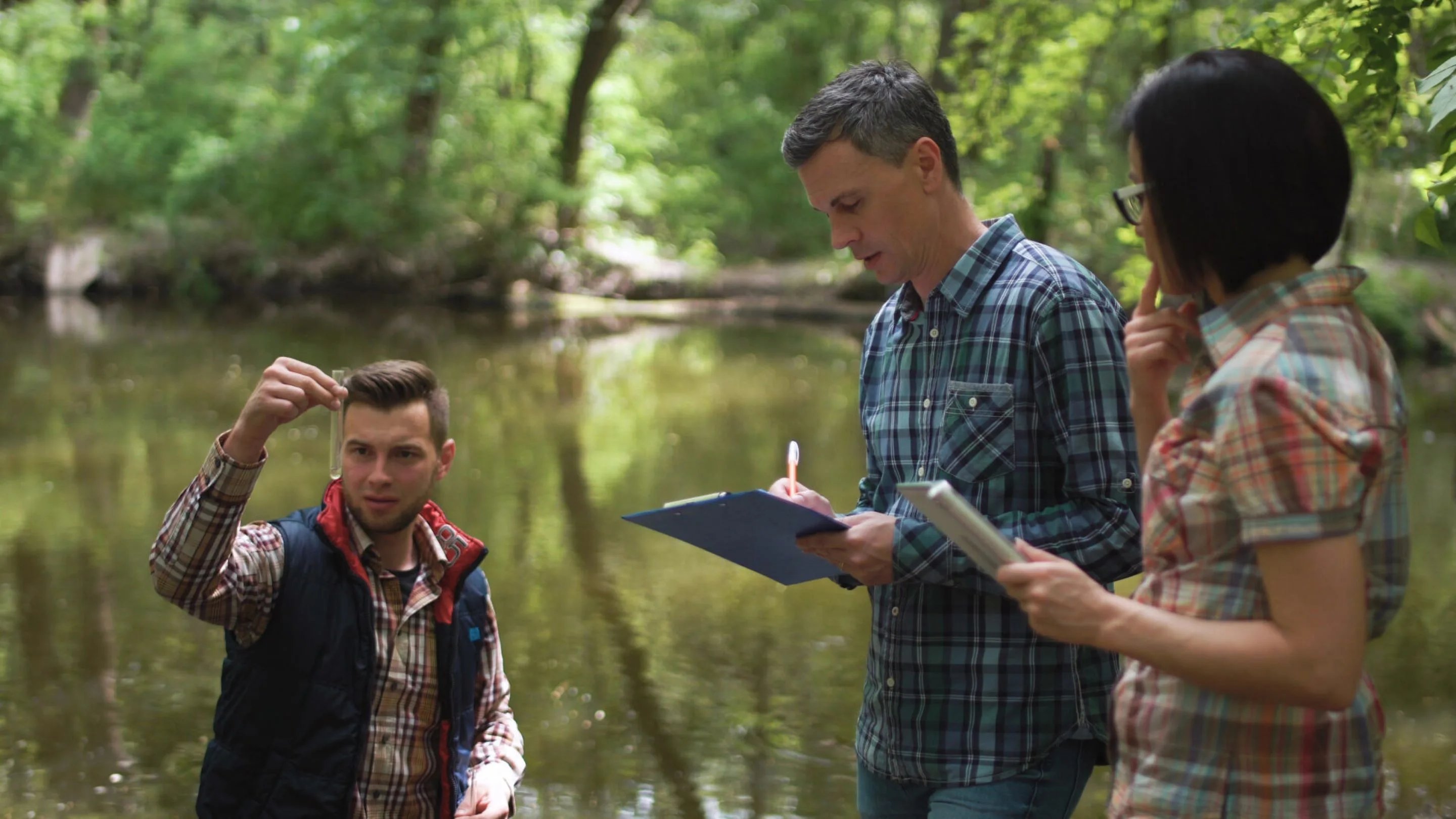 a group of people standing in a forest