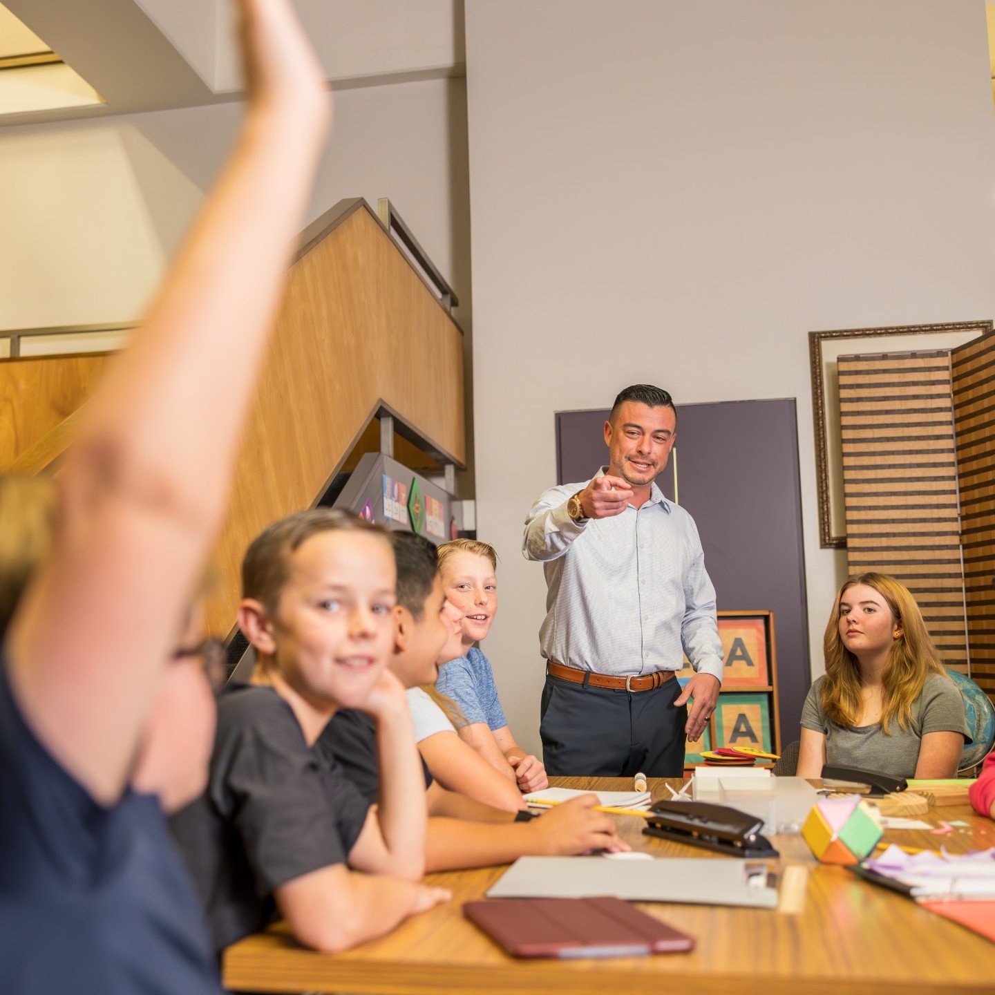 a man standing in front of a group of kids