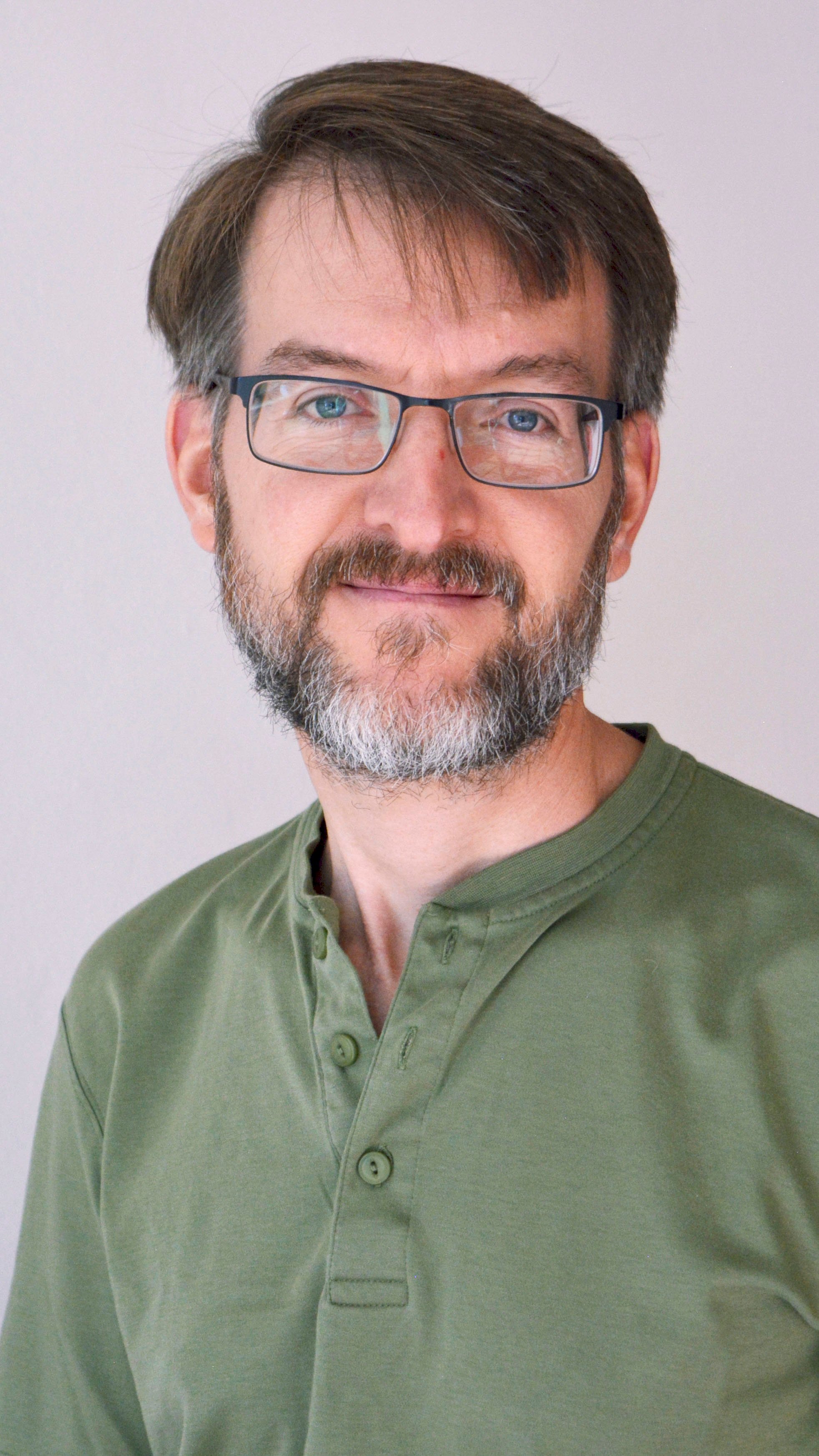 a person with glasses and a beard