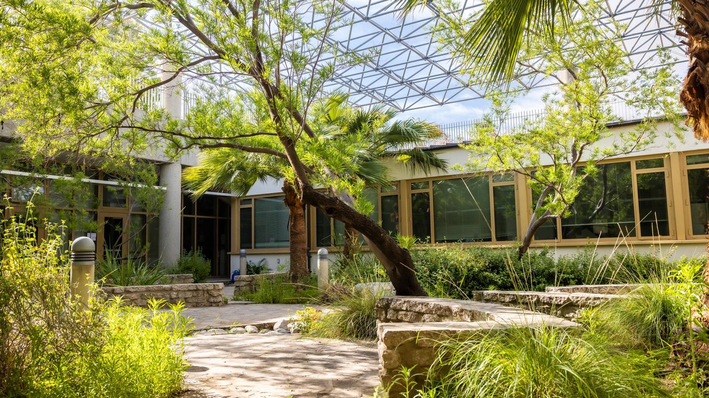 a building with trees and plants