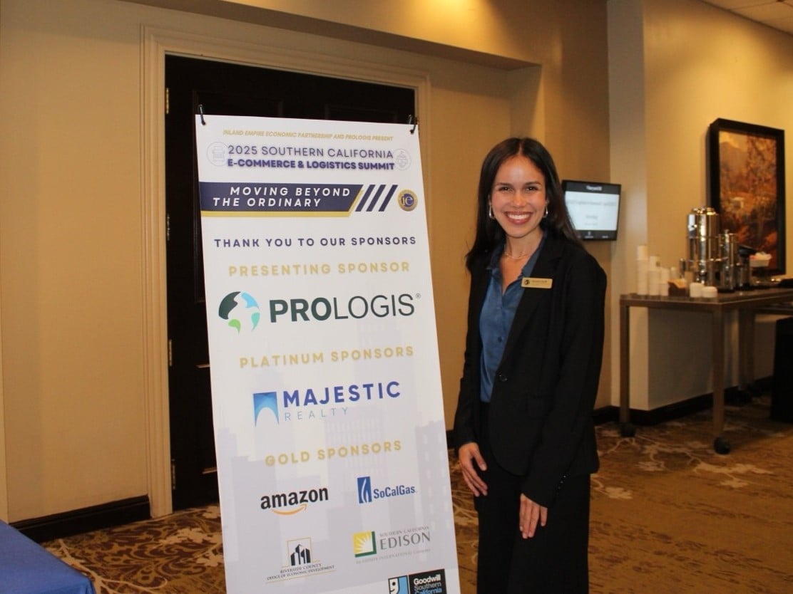 a person standing next to a sign