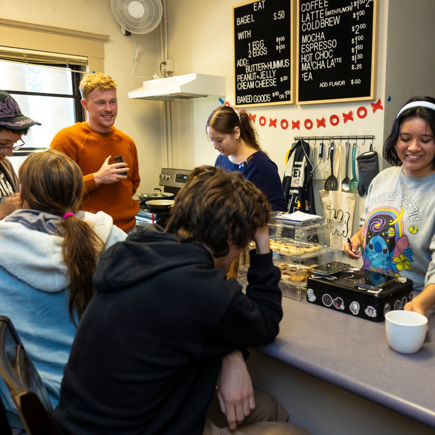 a group of people around a counter