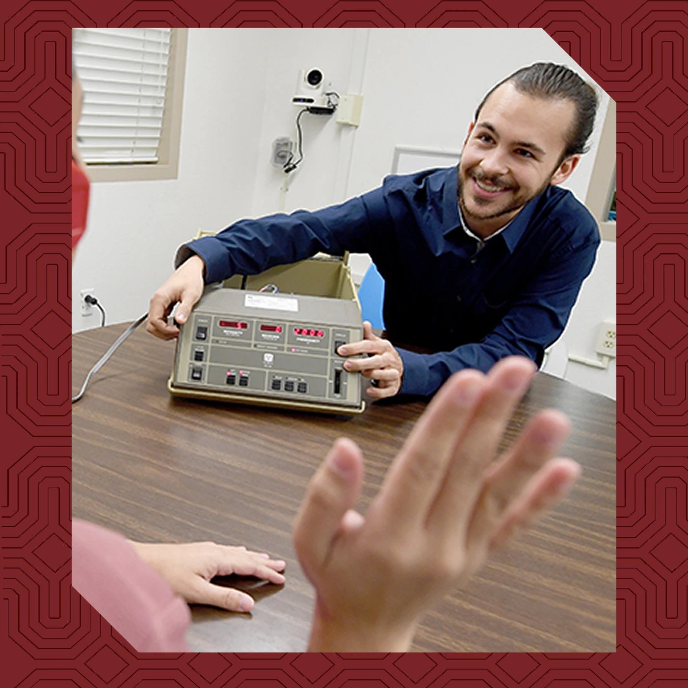 a person smiling at a machine