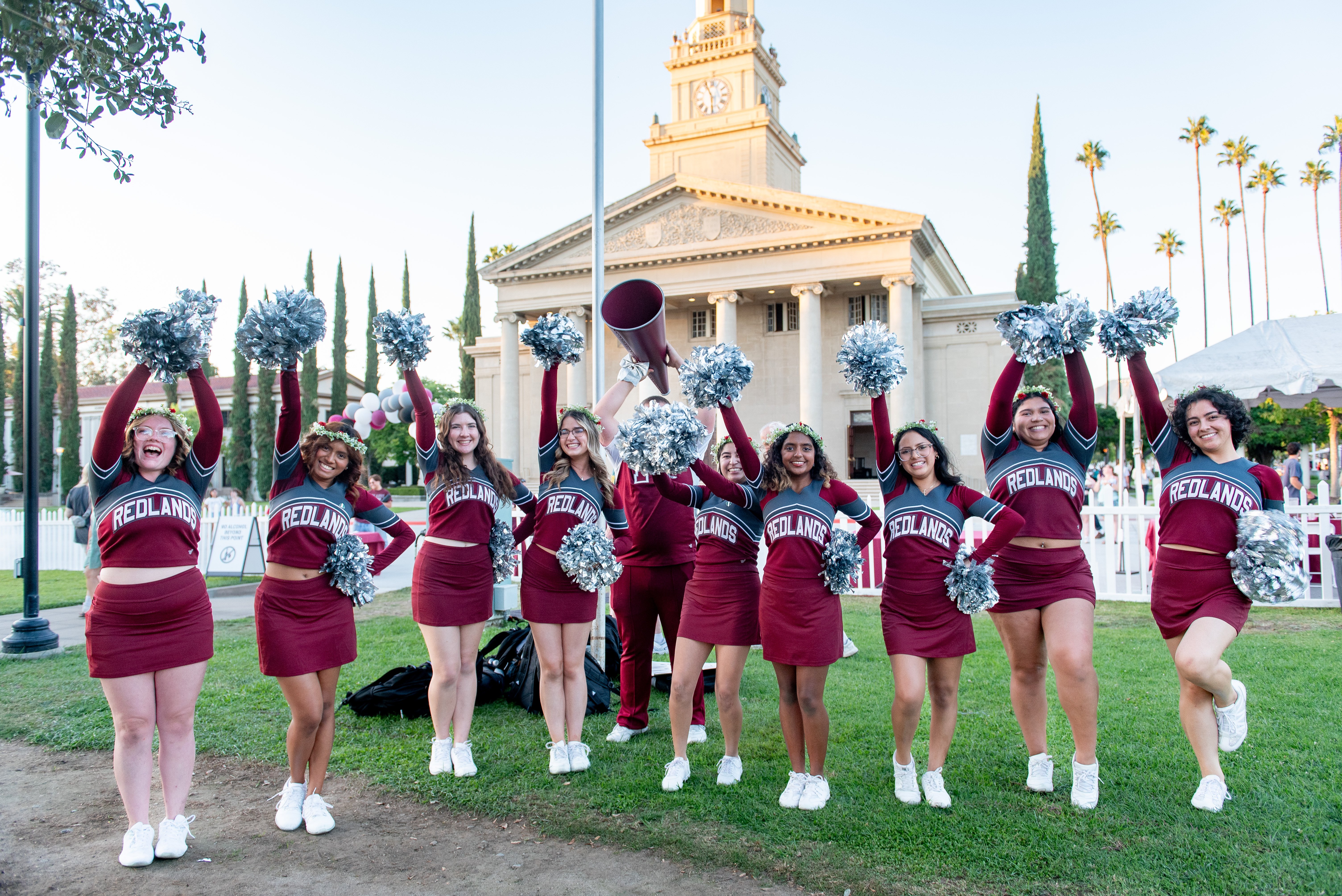 a group of cheerleaders posing for a photo
