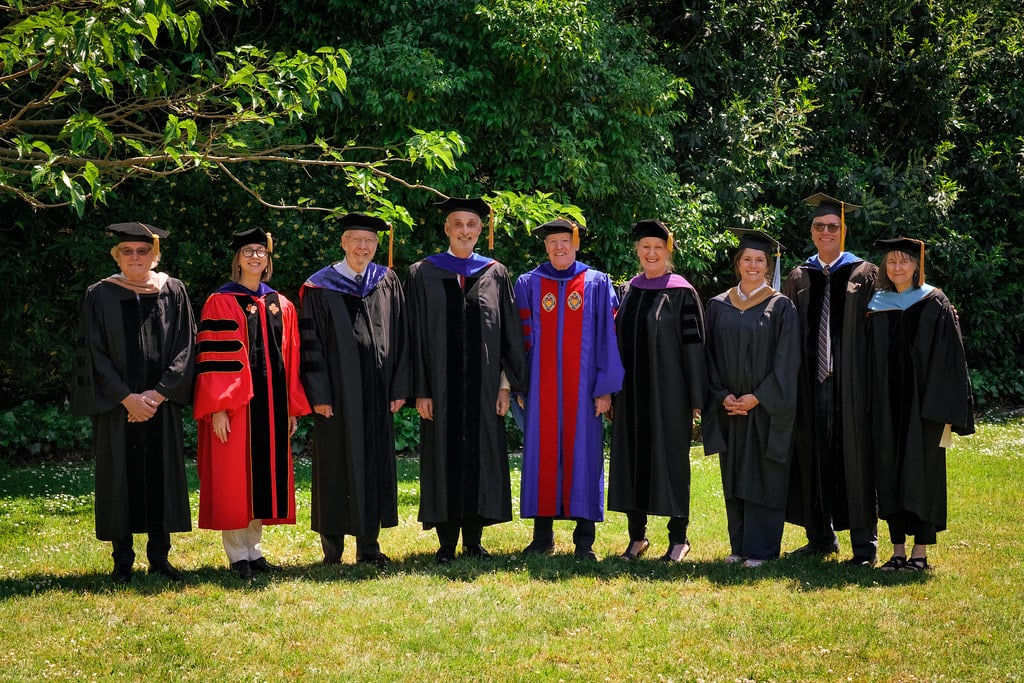a group of people in graduation gowns