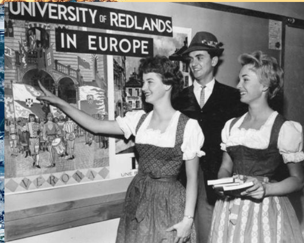 a group of people standing in front of a poster