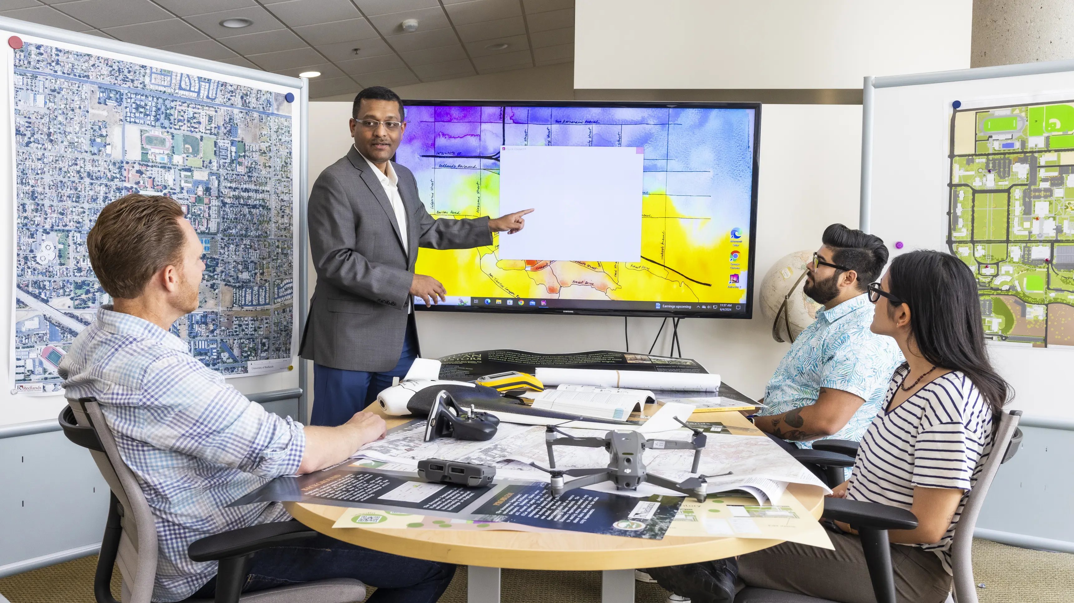 a person pointing at a screen