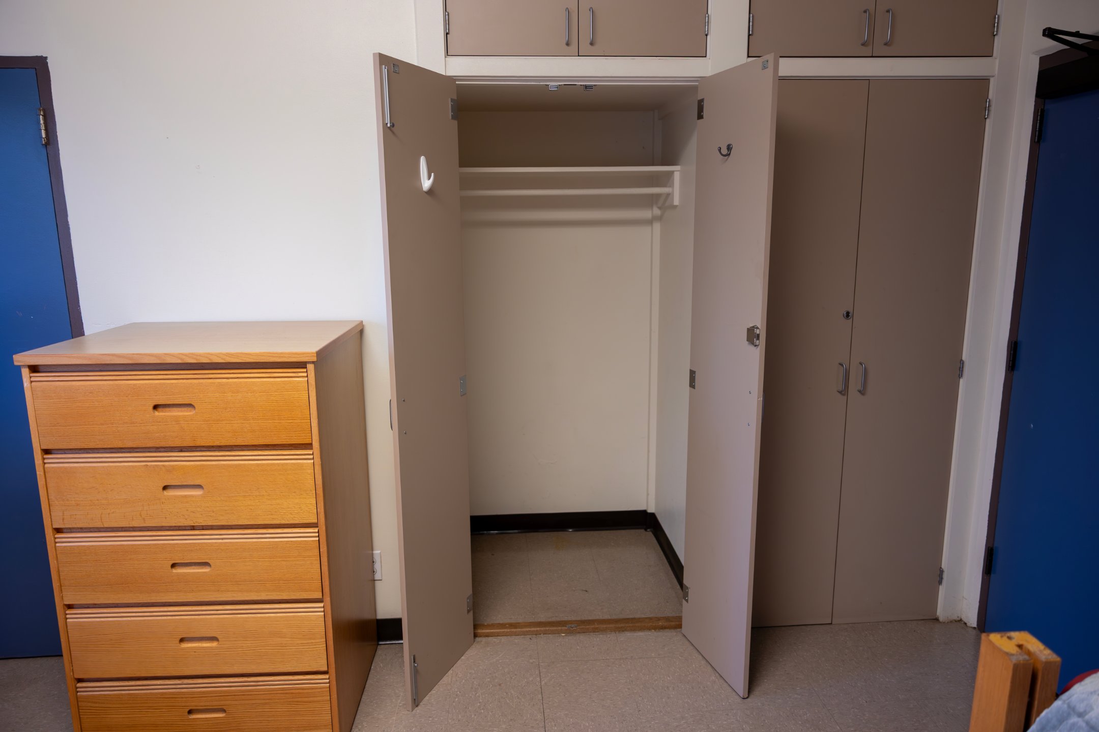 a closet with open doors