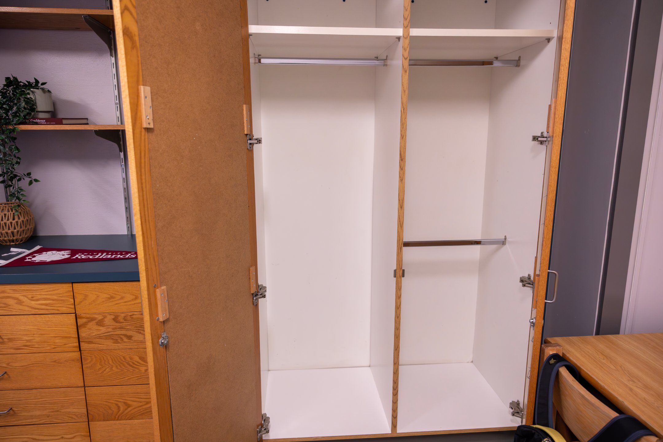 a white closet with open doors